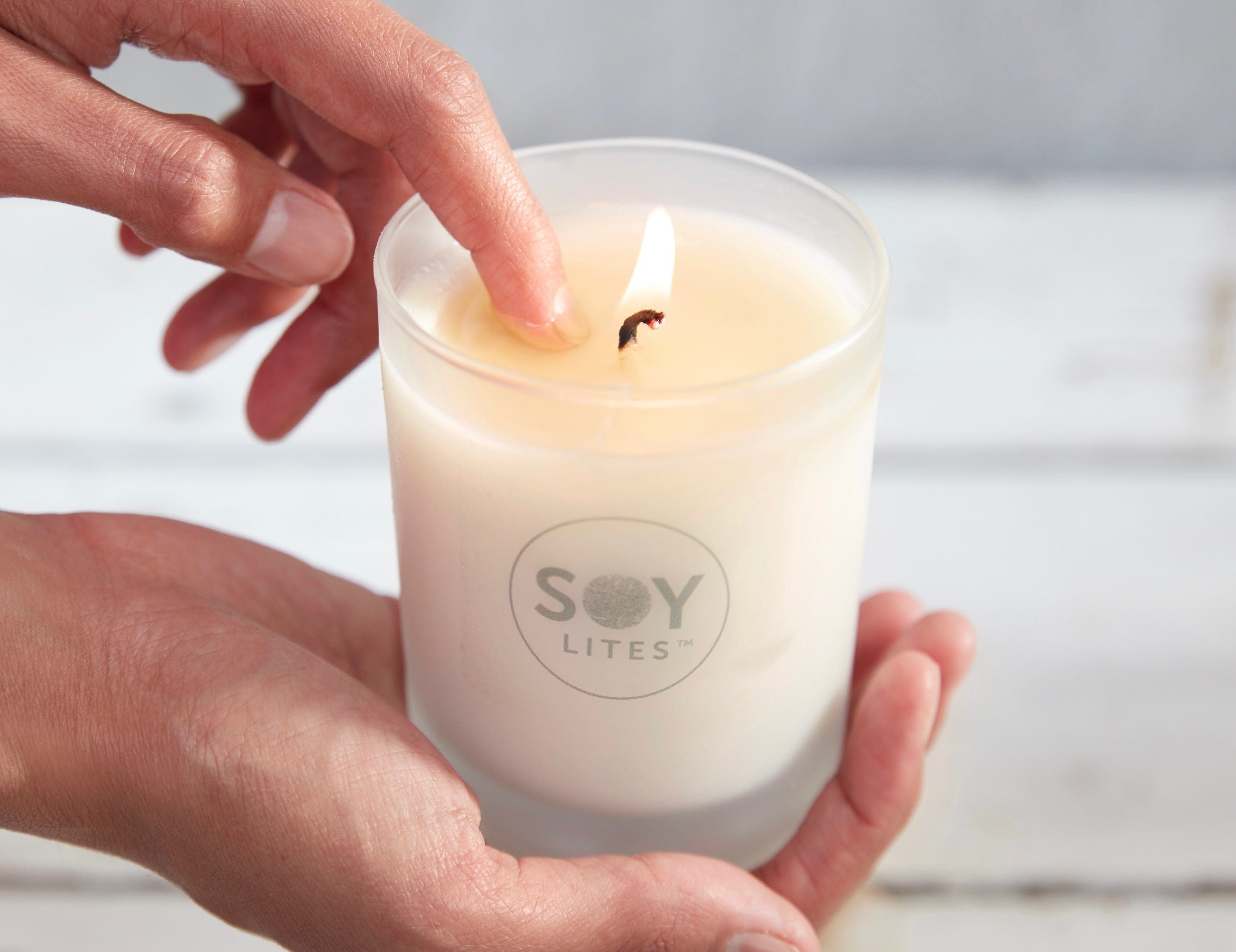 SoyLites Candle Burning And Used As Nourishing Body Oil - Finger Dipping